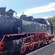 A steam train parked on the tracks
